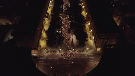 Fire-lit-torches-on-a-parade-during-the-night-in-Montpellier-France