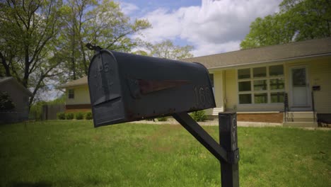 Crooked-mailbox-with-an-address-at-a-house-in-the-suburbs