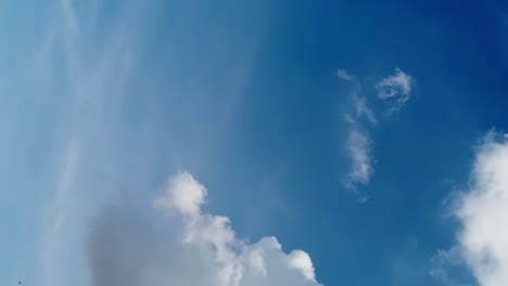 Seamless-loop-of-fluffy-clouds-in-a-blue-sky-in-a-summer-shot-on-a-clear-day