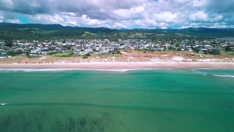 Tide-rolling-in-over-Whangamata-beach