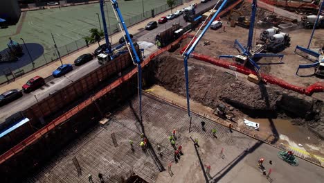 Pouring-concrete-slab-on-the-first-floor-at-a-project-site-in-Brooklyn,-NY---Aerial-view