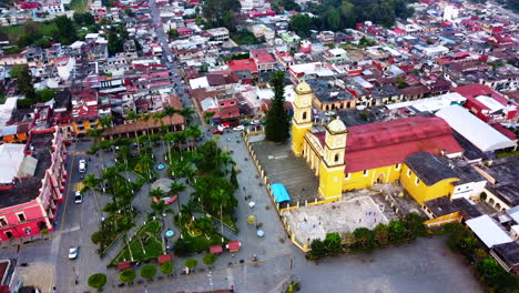 beautiful-aerial-view-with-drone-of-flying-overt-Saint-John-the-Baptist-Parish-of-Coscomatepec,-Veracruz,-Mexico
