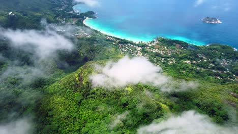 Mahe-Seychelles,-Epic-drone-shot-over-the-clouds-inside-the-national-park