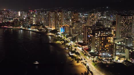 30-fps-night-aerial-waikiki-skyline-honolulu-hawaii-showing-traffic-ocean-and-palm-trees-and-entire-island-with-lots-of-city-lights