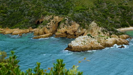 Sea-caves-on-rocky-coastline-at-scenic-Knysna-Heads,-Garden-Route,-South-Africa