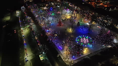 Christmas-lights-in-city-park,-aerial-view