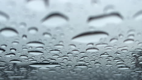 Close-up-of-rain-drops-on-a-glass-roof
