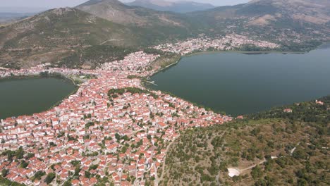 Aerial-clip-over-a-mouintain-and-the-city-and-lake-of-Kastoria,-in-northern-Greece