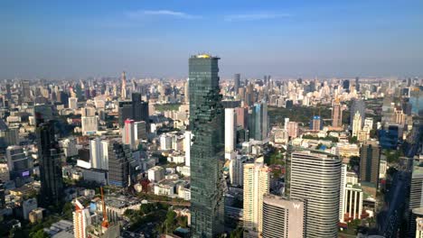 Drone-Shot-of-Mahanakhon-Tower-in-Bangkok,-Silom-area,-business-district,-downtown