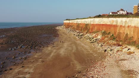 Aerial-view-of-Hunstanton's-Cliffs,-beach-and-low-tide-boulder-field