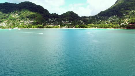 -Mahe-Seychelles,-Beau-Vallon-beach,-a-place-for-water-sports,-2-jetsky,-moving-towards-shore