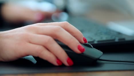 close-up-of-corporate-business-lady-keyboard-typing-and-mouse-scrolling-in-a-office-enviroment