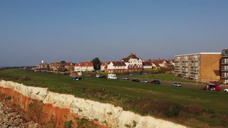 Aerial-view-of-Hunstanton's-cliffs,-lighthouse-and-beach