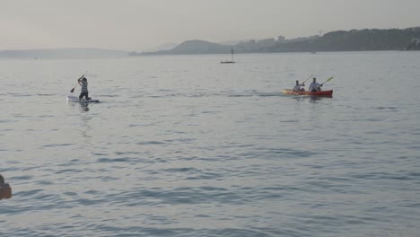 The-coach-waves-to-the-rowers-in-the-beautiful-sea