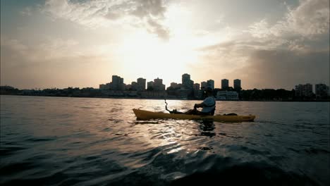 Man-in-a-yellow-kayak-fishing-out-in-the-open-ocean