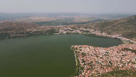 Aerial-clip-over-a-mouintain-revealing-the-city-and-lake-of-Kastoria,-in-northern-Greece