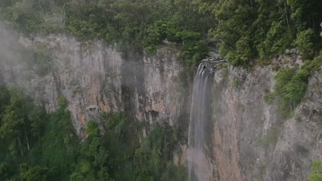Aerial-view-of-Purling-Brook-Falls-in-Springbrook-National-Park,-Gold-Coast-Hinterland,-Queensland,-Australia