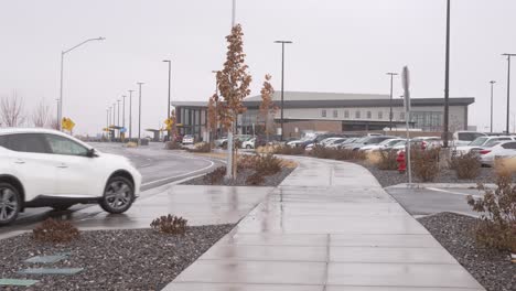 Sidewalk-leading-to-the-Provo-Utah-Municipal-Airport-at-daytime-with-snow,-sleet-and-rain-in-winter