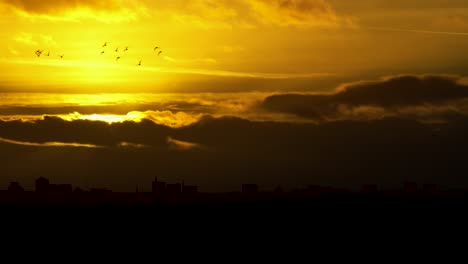 Cityscape-City-Skyline-Coventry-UK-Sunset-Clouds-Birds-Flying-Slow-Motion-Aerial-View