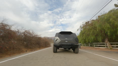 Follow-Me-Shot-Of-Stunning-Off-road-Car-Design-Speeding-On-Rural-Street