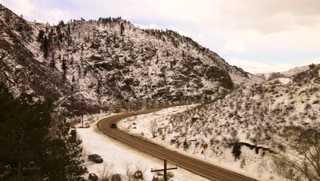 Cars-driving-on-road-in-the-canyon-during-the-winter