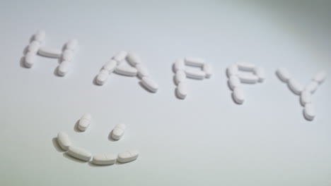 Pills-forming-smiley-face-on-white-background