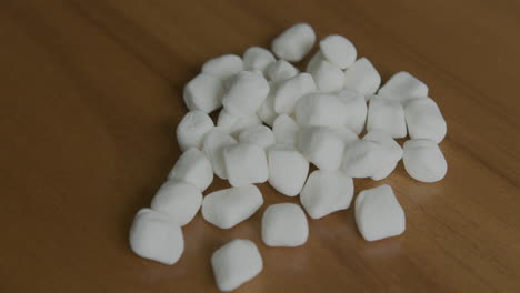 Close-Up-Tilt-Up-of-a-Pile-of-Mini-Marshmallows