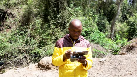 Airplane-industrial-UAV-innovative-drone-pilot-taking-drone-photography-operating-security-drone-in-the-forest-of-Kenya