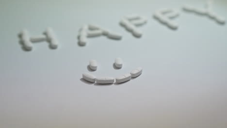 Pills-forming-smiley-face-on-white-background