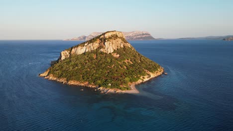 Figarolo-Island-during-twilight-in-Golfo-Aranci,-Sardinia,-Italy---4k-Aerial