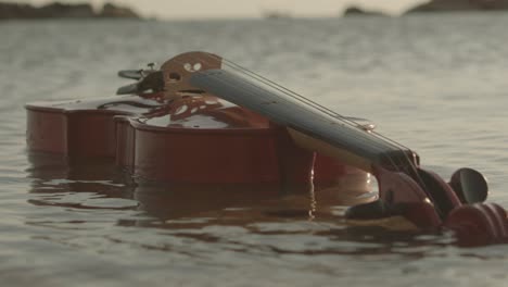 A-classic-violin-is-floating-on-sea-water