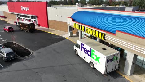 FedEx-and-UPS-trucks-at-Dollar-General-and-Target-retail-stores