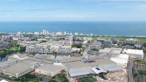 Drone-shot-of-Gateway-Theatre-of-Shopping-in-Durban-South-Africa-with-Indian-Ocean-in-background
