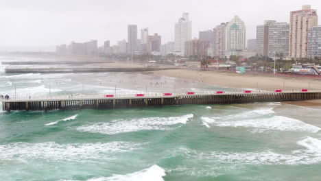 Rainy-drone-shot-of-the-beachfront-and-promenade-of-Durban-South-Africa