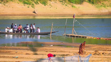 Traditional-wooden-Bangladesh-ferry-boat-in-Surma-river,-handheld