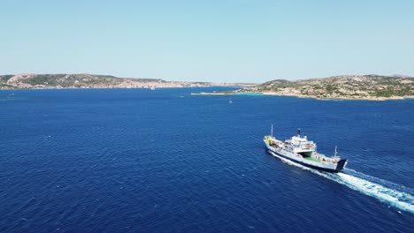 Ferry-sails-from-Palau-to-La-Maddalena-Islands-in-Sardinia,-Italy---Aerial-4k