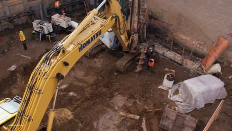 Guiding-earth-auger-machine-for-excavation-at-Flushing-NewYork-site