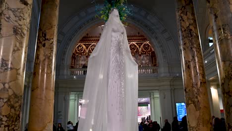 Korean-designer-unveils-couture-grew-for-a-Christmas-tree-art-installation,-Victorian-and-Albert-Museum,-London,-United-Kingdom