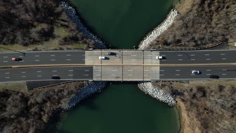 An-aerial-view-directly-above-a-highway-on-Long-Island,-NY-on-a-sunny-day