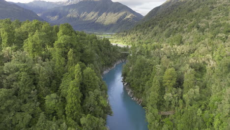 Famous-blue-river-through-Hokitika-Gorge-on-South-Island-in-New-Zealand,-aerial