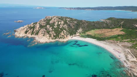 Monti-Russu-beach-and-cove-at-Costa-Paradiso,-Sardinia,-Italy---Cinematic-Aerial-4k