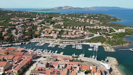 Stintino-Port-and-Harbor-Town-in-Sassari,-Sardinia,-Italy---Aerial-4k