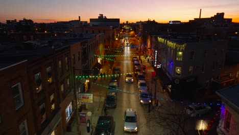 People-enjoy-urban-city-street-light-display-at-Christmas