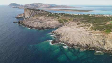Rocky-Coastline-at-La-Pelosa-and-Asinara-National-Park,-Sardinia---Aerial-4k-Circling