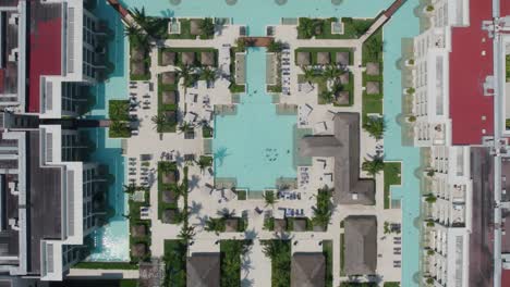 Lowering-aerial-view-of-a-large-pool-system-at-Paradisus-Playa-del-Carmen-in-Mexico
