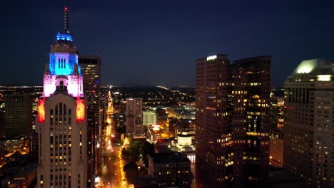 Aerial-Downtown-Columbus-at-Night---Leveque-Tower,-Ohio-Statehouse