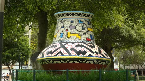 A-big-vase-art-decoration-in-a-public-park-called-"Parque-Kennedy"-located-in-Lima,-Peru-in-the-Miraflores-district