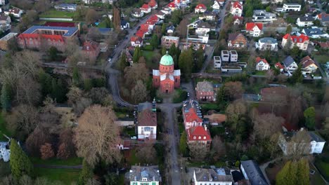 Zoom-in-aerial-drone-shot-of-Christuskirche-in-the-small-german-town-Lahr-in-Schwarzwald