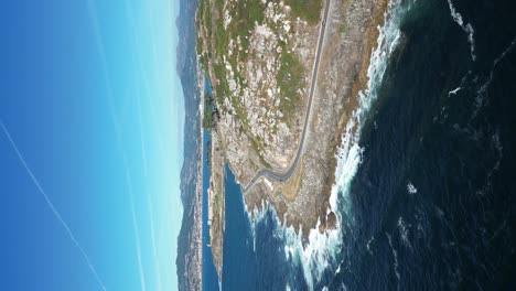 Vertical-video-from-waterfront-road-by-the-Atlantic-Ocean,-Galicia-Coastline,-Baiona