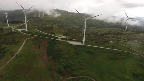 Aerial-drone-of-wind-farm-Wind-Turbines-in-fog-and-clouds